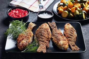 Canvas Print - freshly fried breaded crucian carps, top view