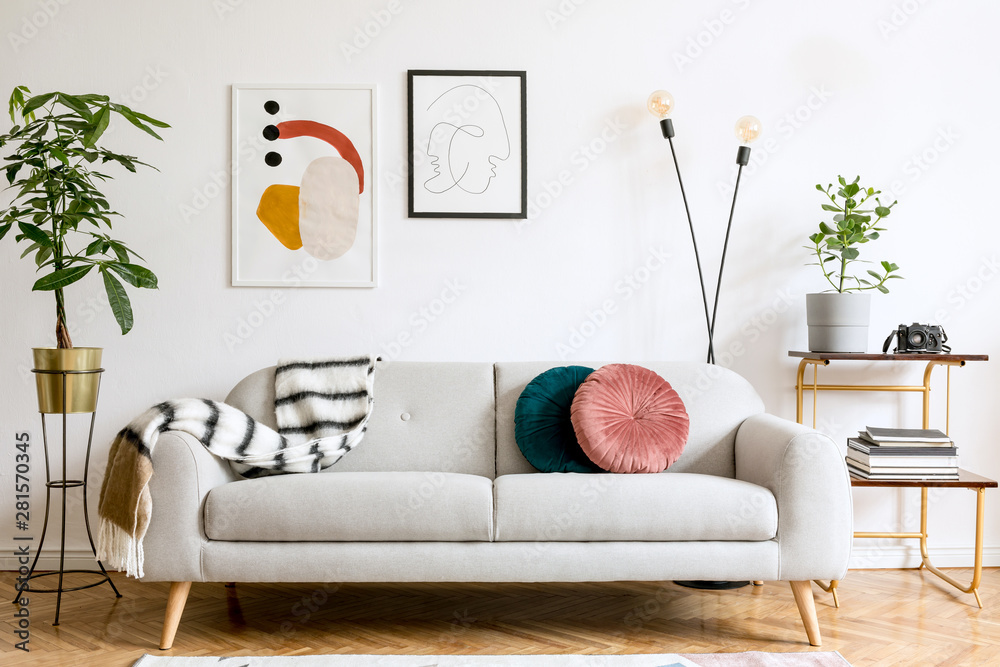 Minimalist interior design of living room with sofa and framed posters ...