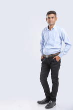 Young Indian Man Standing Over White Background