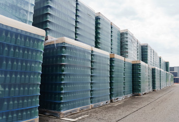 A lot of wrapped empty beer bottles on pallets