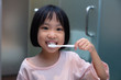 © Tan Kian Khoon - Asian Little Chinese Girl brushing her teeth