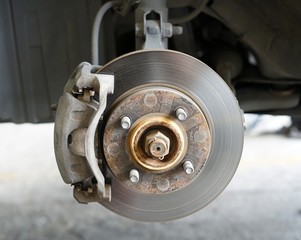 A front left wheel disc car brake suite.