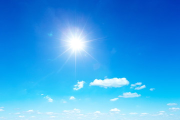 Poster - sun in blue sky background with tiny clouds