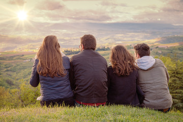 Poster - Christian worship and praise. Group of friends hugging outdoors at sunset.