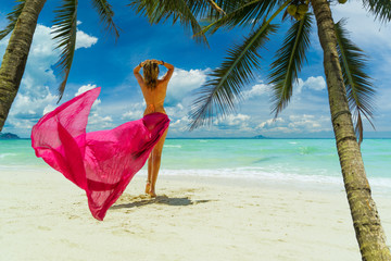 Cute woman relaxing on the summer beach.