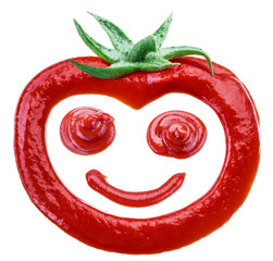 Tasty tomato ketchup in the shape of smiling tomato fruit isolated on white background.