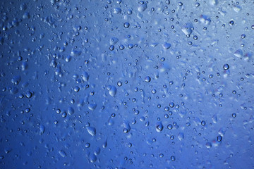 Poster - water drop on blue plastic texture