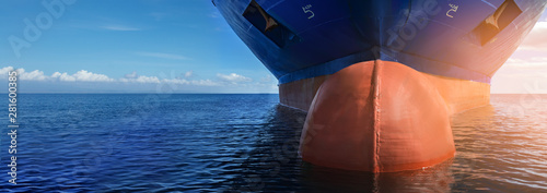 Fotografía Close up of large blue merchant crago ship in the middle of the ocean underway