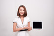 © makistock - Asian business woman holding ipad tablet