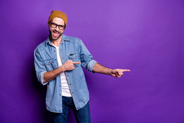 Sticker - Portrait of his he nice attractive confident cheerful cheery glad bearded guy pointing two forefingers aside best ad advert copy space isolated over bright vivid shine violet lilac background