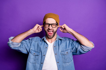 Poster - Portrait of his he nice attractive fury aggressive crazy bearded guy closing ears with fingers screaming isolated over bright vivid shine violet lilac background