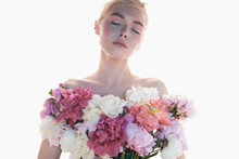 Young Beautiful Woman With Bouquet Of Roses. Professional Art Makeup.