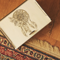 Wall Mural - Wooden box on a background of wooden floor and carpet. Handmade box