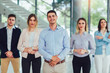 © Mediteraneo - Group of happy business people and company staff in modern office, representing company