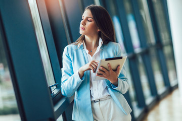 Young woman using digital tablet in the office