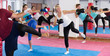 © JackF - Group of adult female are boxing and doing kick with coach