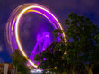 Giant Ferrieswheel moving with speed during long exposure nightscape photography in an Amusement park