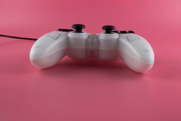 game controller isolated on pink background