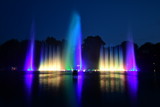 Fototapeta Tęcza - Choreographed colored water light games in Hamburg - In the Park Planten un Blomen
