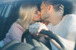 © irina_timokhina - Couple in love man and woman kissing sitting in the car