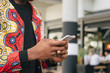 © Nathan Lunda/PICHA - Man checking his mobile phone