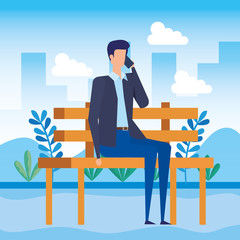 Wall Mural - elegant businessman calling with smartphone seated in the park chair