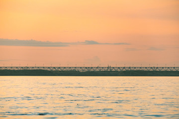 View of the city of Khabarovsk from the Amur river. Urban landscape in the evening at sunset.