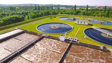 Wall Mural - Aerial view to sewage treatment plant. Grey water recycling. Waste management theme. Ecology and environment in European Union.