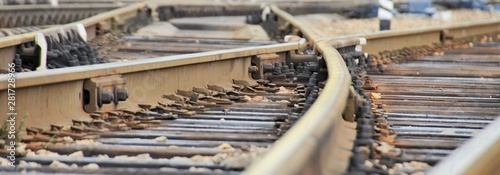 Fotografía Railroad rails at a small station, fork, arrows, mechanical elements, wide view