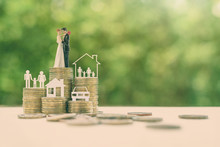 Sustainable Financial Goal For Family Life Or Married Life Concept : Miniature Wedding Couple, Parent & Child, A House Or Home, A Car On Rows Of Rising Coins, Depicts Savings Or Growth For New Family