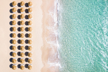 Sticker - View from above, stunning aerial view of an amazing white beach with beach umbrellas arranged symmetrically and a beautiful turquoise clear water. Sardinia, Italy.