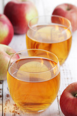 Wall Mural - Two glasses with apple juice