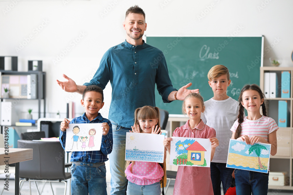 Cute children with teacher in classroom Stock Photo | Adobe Stock