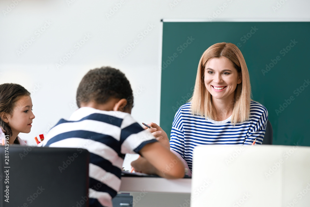 Teacher conducting lesson in classroom