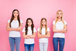 © deagreez - Two little and two students ladies crossing arms self-confident wear casual outfit isolated pink background