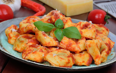 Poster - Italian traditional tortellini pasta in a plate on table