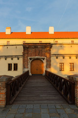 Wall Mural - Špilberk Castle and the entrance gate to the center of Brno Czech Republic captured directly on the wooden bridge during the summer sunset.