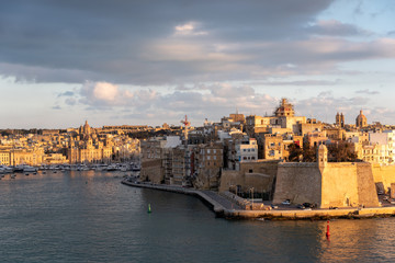 view of the urban landscape and the port of marseille at sunset