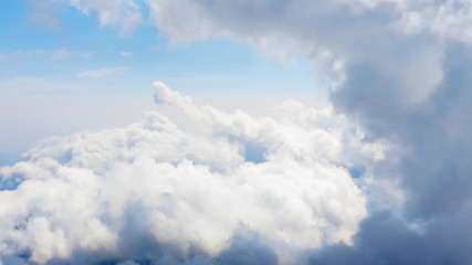 Wall Mural - flying through heavenly beautiful cloudscape. picturesque timelapse of white fluffy clouds moving so