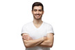 © Damir Khabirov - Smiling handsome man in casual t-shirt standing with crossed arms, isolated on white background