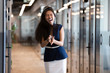 Funny happy asian businesswoman winner feel overjoyed standing in office