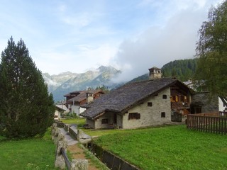 Wall Mural - The architecture of the small town of Macugnaga and its hamlets, in the Italian Alps - July 2019.