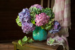 Bouquet of hydrangea flowers in a vase on a chair