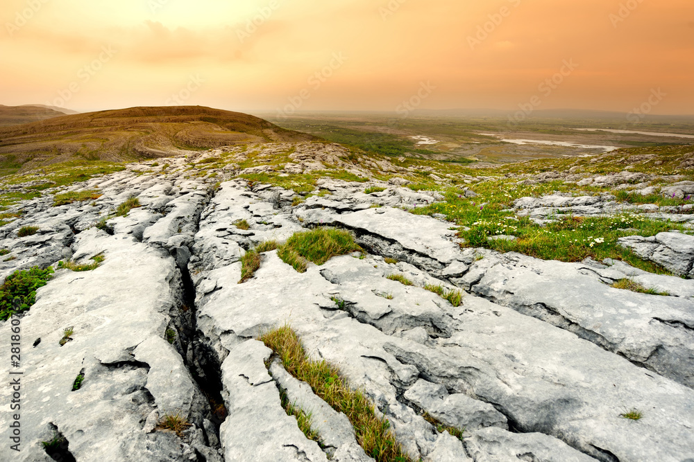 Spectacular landscape of the Burren region of County Clare, Ireland. Exposed karst limestone bedrock at the Burren National Park. - obrazy, fototapety, plakaty 