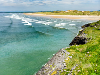 Spectacular Tullan Strand, one of Donegal's renowned surf beaches, framed by a scenic back drop provided by the Sligo-Leitrim Mountains.