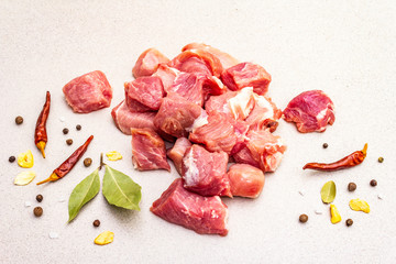 Raw fresh pork shoulder, cut into pieces with spices