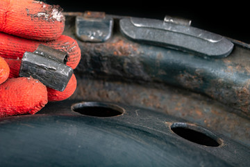 Lead weights on the rim. Accessories for the vulcanizer in the workshop.