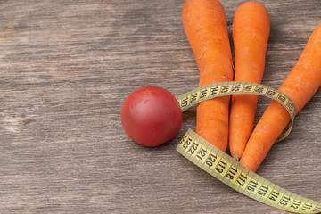 juicy carrots on an old wooden surface