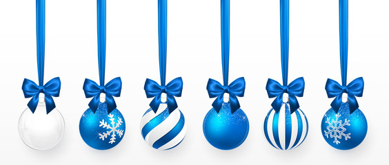 Wall Mural - transparent and blue christmas ball with snow effect and blue bow set. xmas glass ball on white back