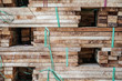 Close up manufacturing shot of wooden furniture parts on a pallet at a factory in southern Vietnam